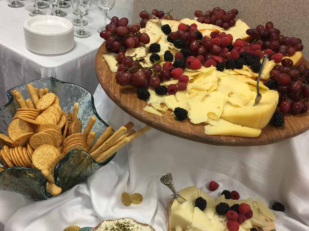 cheese-crackers-and-fruit-on-table-with-white-table-cloth-at-event-westport-ma